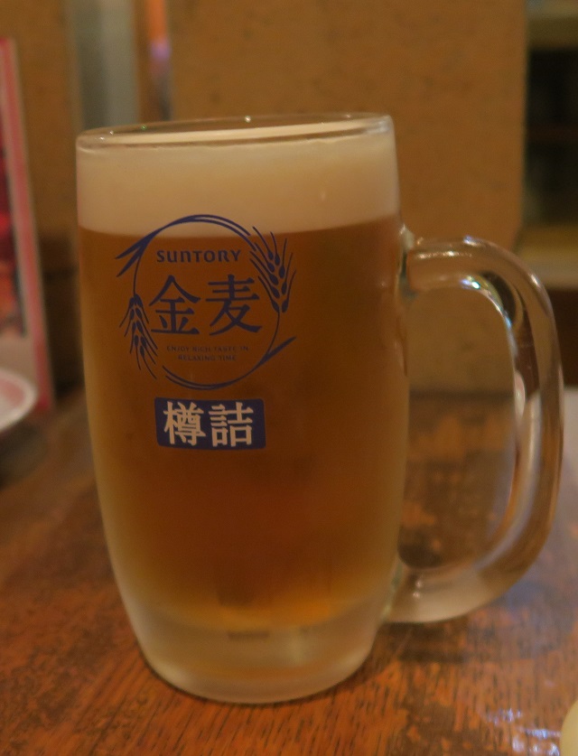 「大衆中華とお酒の場　マカト」のビールを撮影した写真