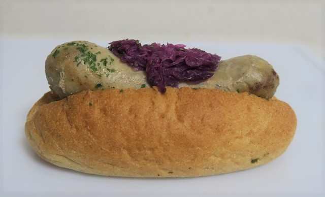 DELICATESSEN TRUNQ小禄店の島豚のソーセージドックを撮影した写真